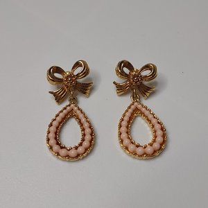 Gold Tone And Pink Teardrop Shaped Dangle Earrings With Bow
